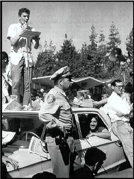 Police Car surrounded in front of Sproul Hall, Jack Weinberg can be seen in the back seat - Howard Harawitz photo - jpg (37296 bytes)